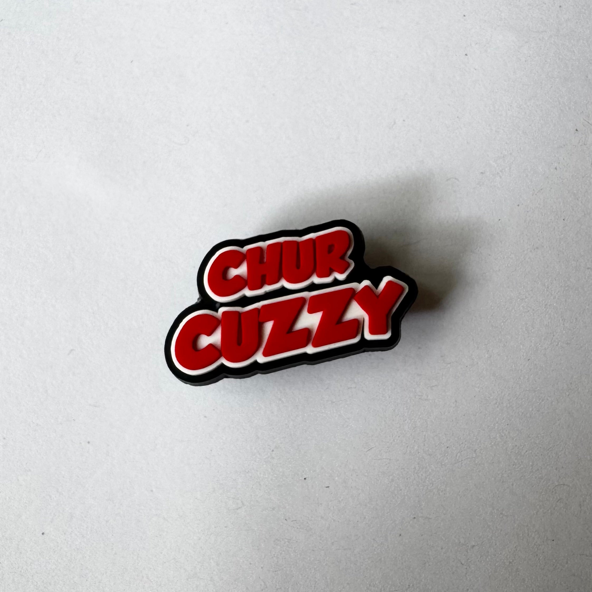 Chur Cuzzy Charm